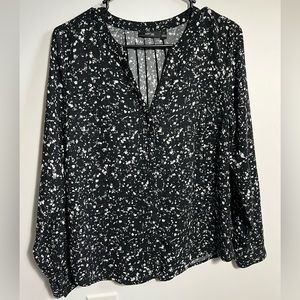 Speckled black and white top.